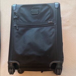TUMI carry on Black Rolling Suitcase